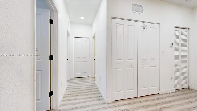 an aerial view of a house with garden space and sitting area