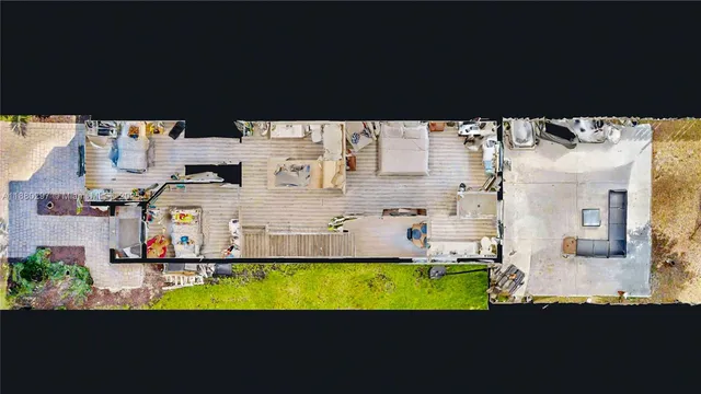 a balcony with table and chairs