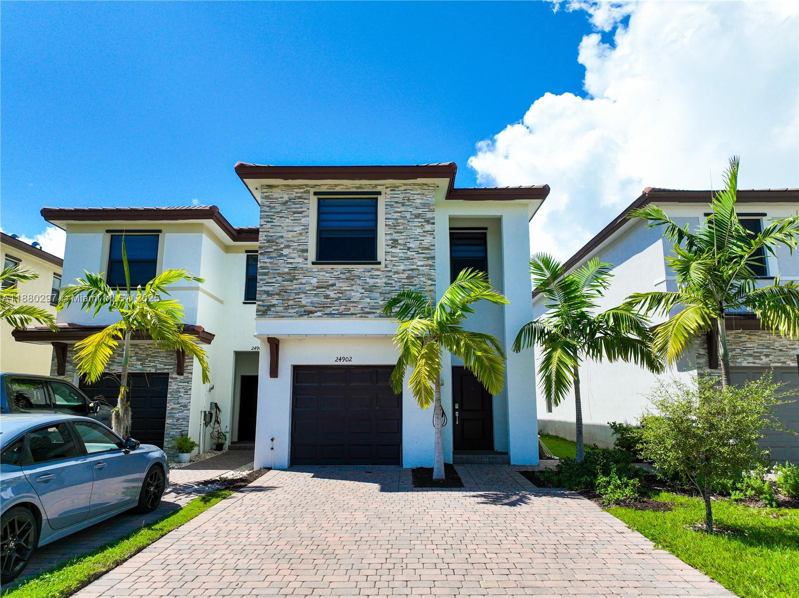 24902 Southwest 107th Avenue Homestead, FL 33032 - Photo 51 of 73 a front view of a house with a yard