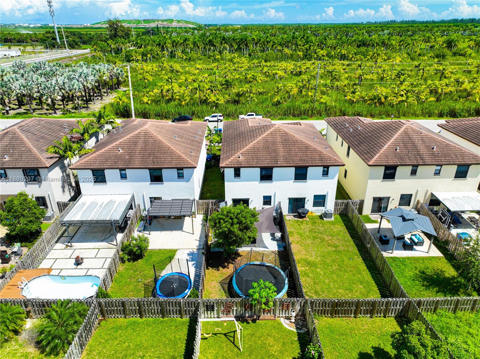 24902 Southwest 107th Avenue Homestead, FL 33032 - Photo 57 of 73 an aerial view of a house with swimming pool garden and patio
