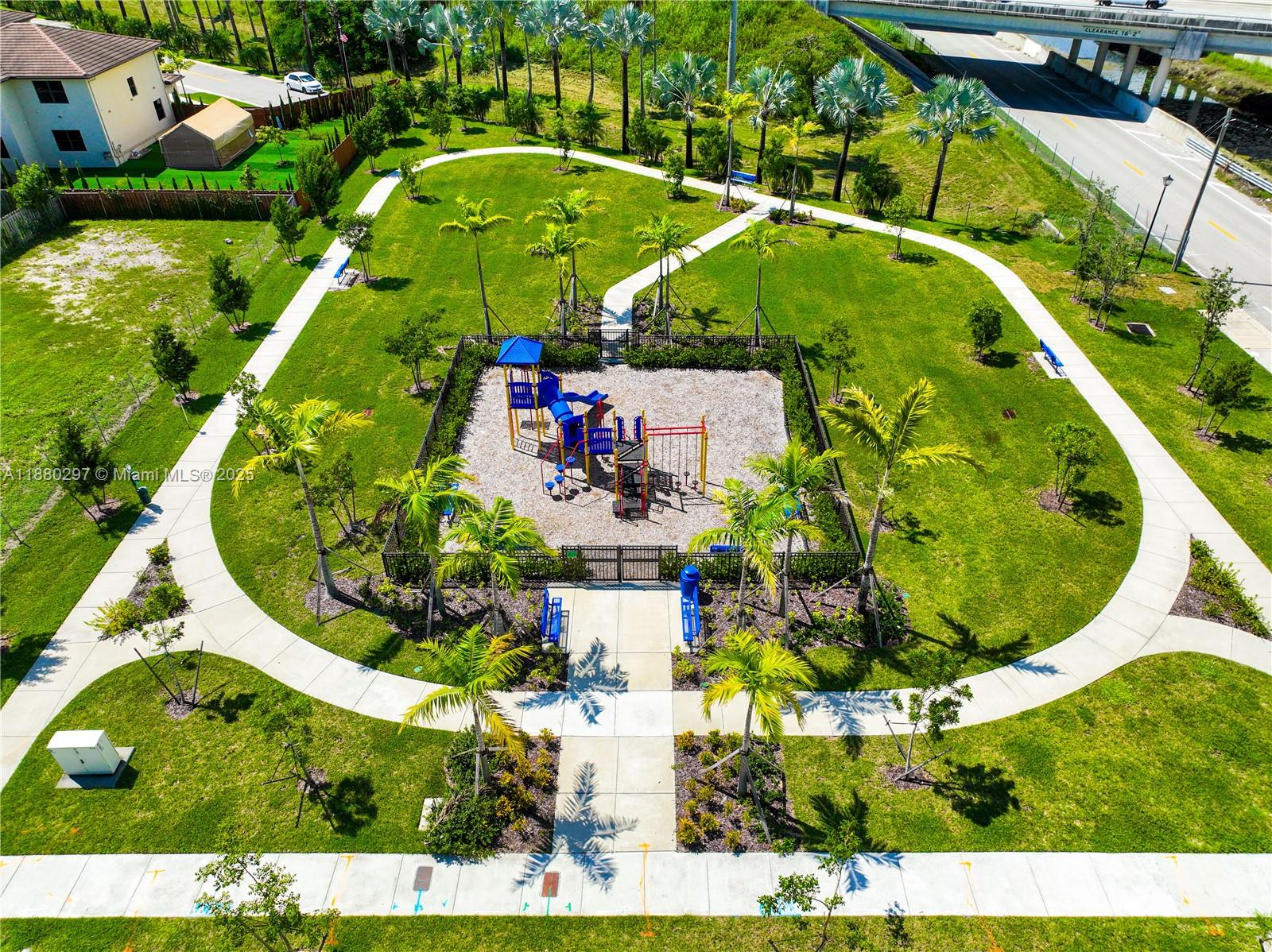 24902 Southwest 107th Avenue Homestead, FL 33032 - Photo 63 of 73 an aerial view of a house with a garden and swimming pool