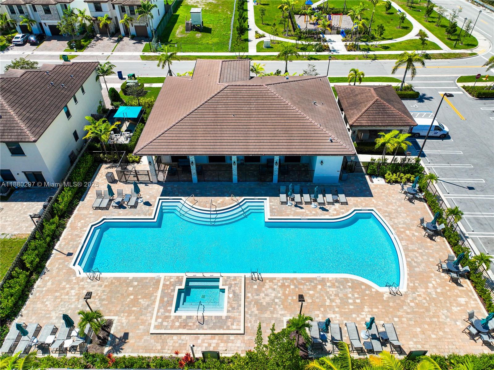24902 Southwest 107th Avenue Homestead, FL 33032 - Photo 67 of 73 an aerial view of a house with swimming pool and a yard
