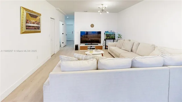 a kitchen with stainless steel appliances a refrigerator and a sink