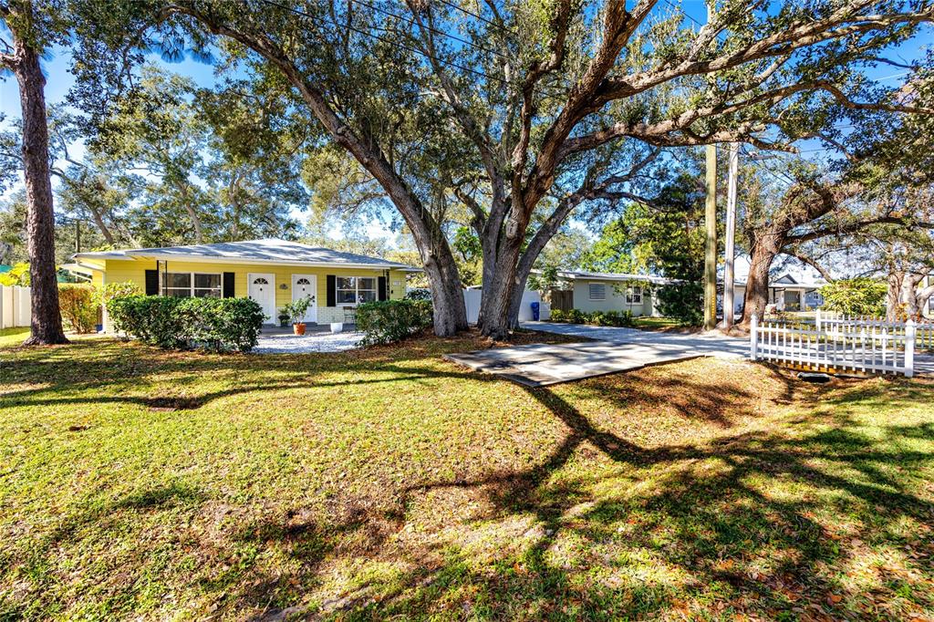 5596 100th Way North St. Petersburg, FL 33708 - Photo 67 of 67 a swimming pool with outdoor seating and yard