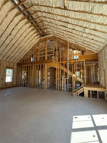 a view of a patio with table and chairs