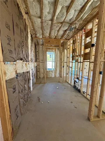 a view of an empty room with windows