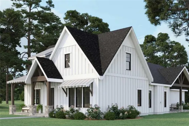 a view of a white house next to a yard