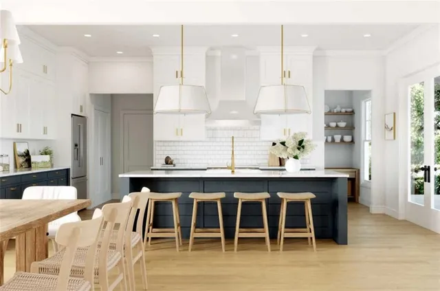 a large kitchen with a table and chairs in it