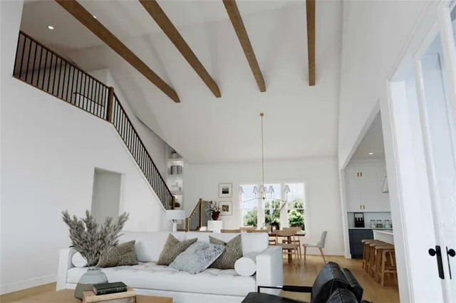 a living room with furniture or chandelier and a dining table