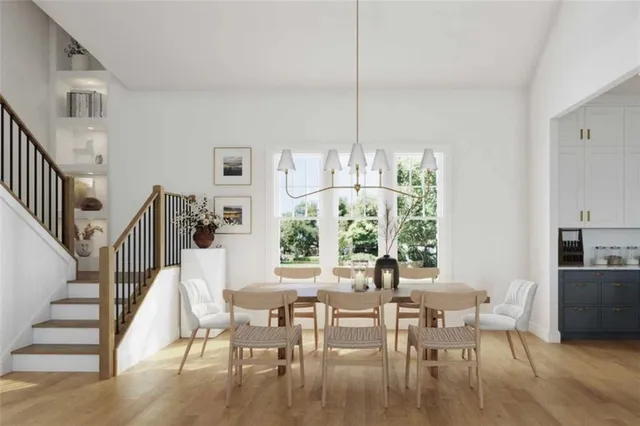 a view of a dining room with furniture window and wooden floor