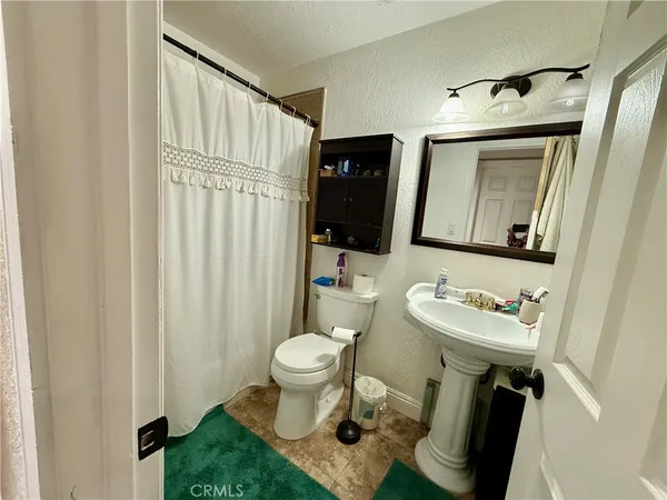 a bathroom with a toilet sink and a bathtub