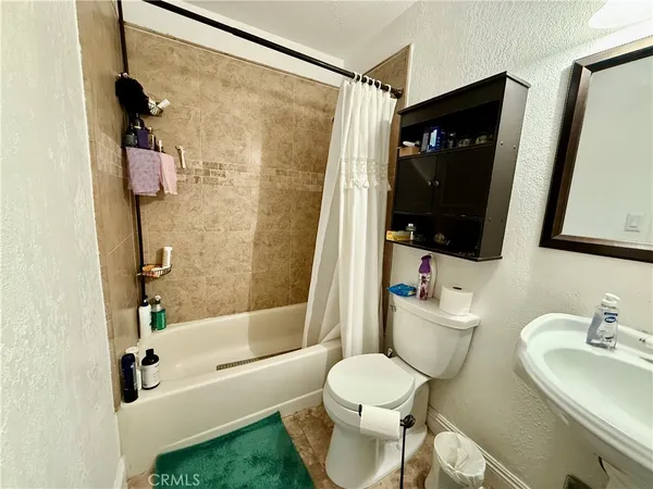 a kitchen with a sink appliances and cabinets