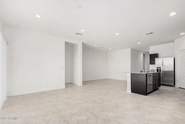 a view of kitchen with refrigerator stove microwave and refrigerator
