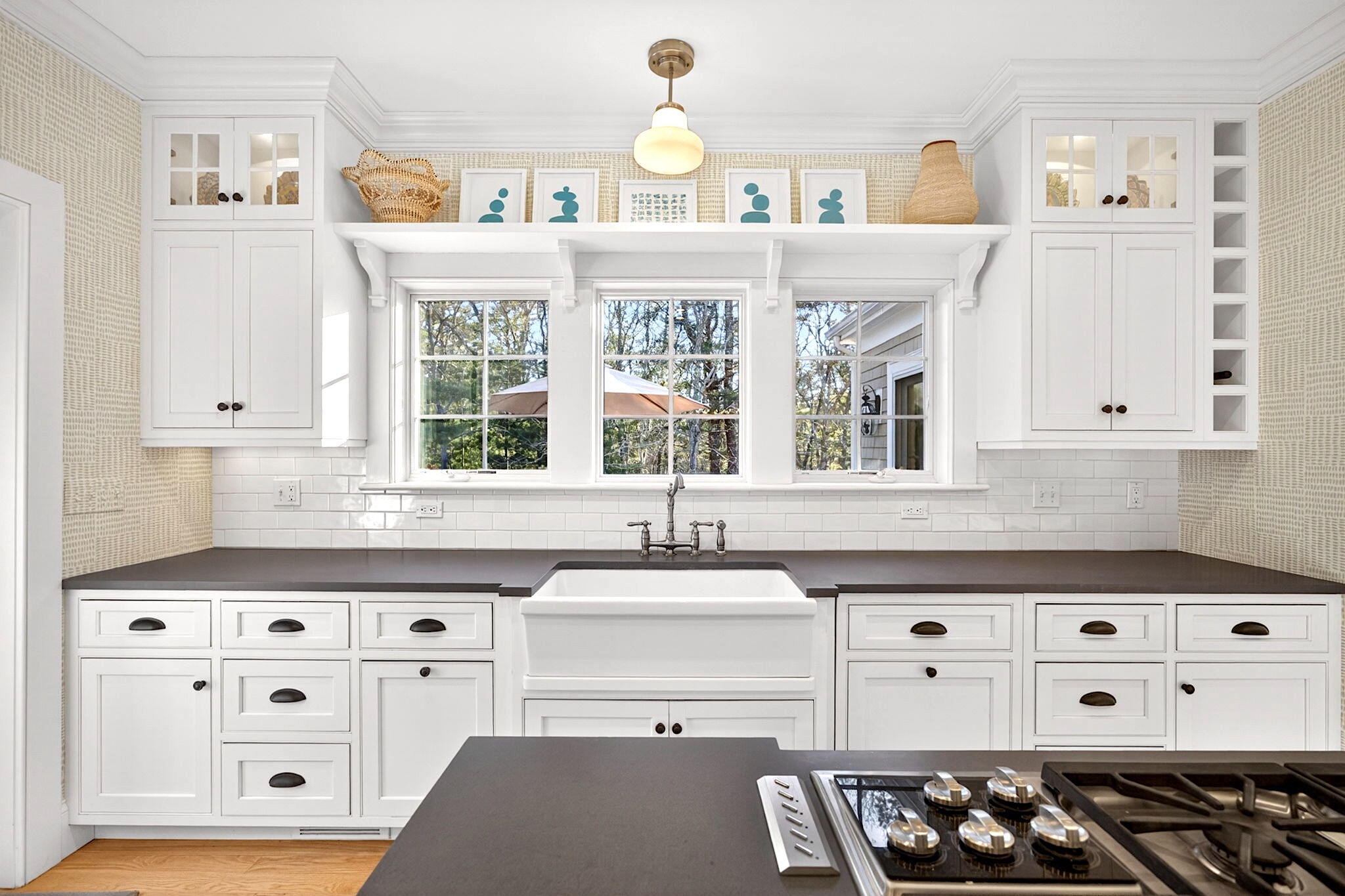 205 Little River Road Cotuit, MA 02635 - Photo 15 of 60 a kitchen with stainless steel appliances a stove a sink and a window
