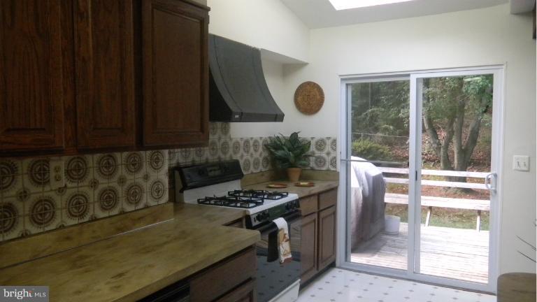907 Whitehall Street Silver Spring, MD 20901 - Photo 9 of 25 KITCHEN W/SLIDING GLASS DOORS TO BACK DECK