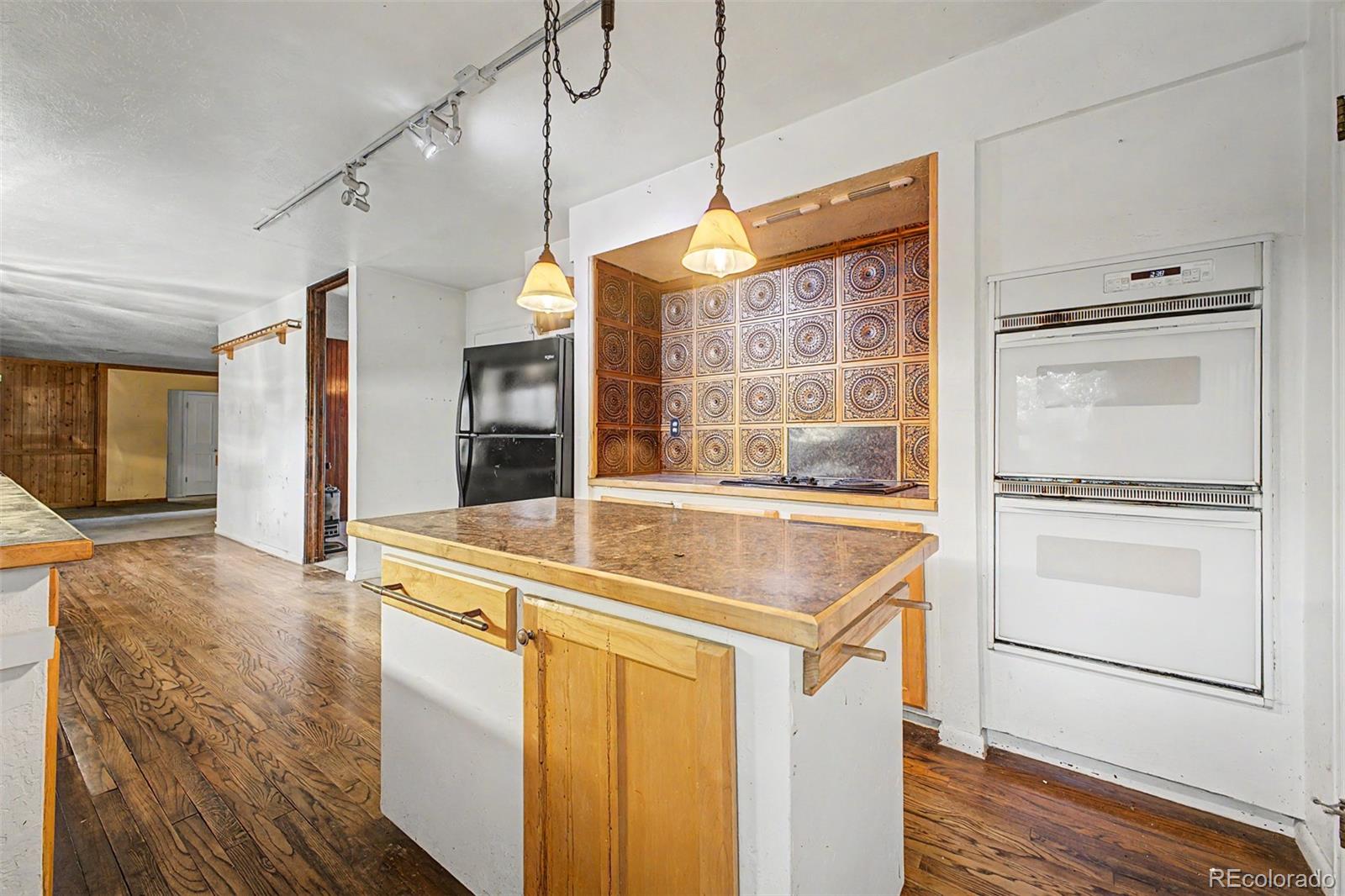 1600 Northwestern Road Longmont, CO 80503 - Photo 11 of 41 a kitchen with a sink stove and refrigerator