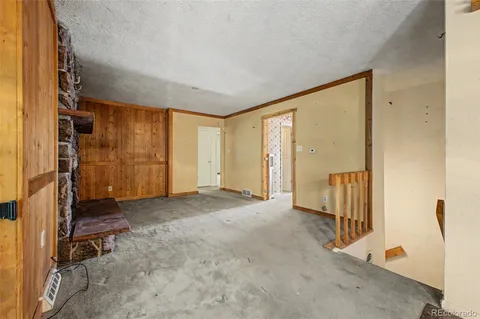 an empty room with a window and storage