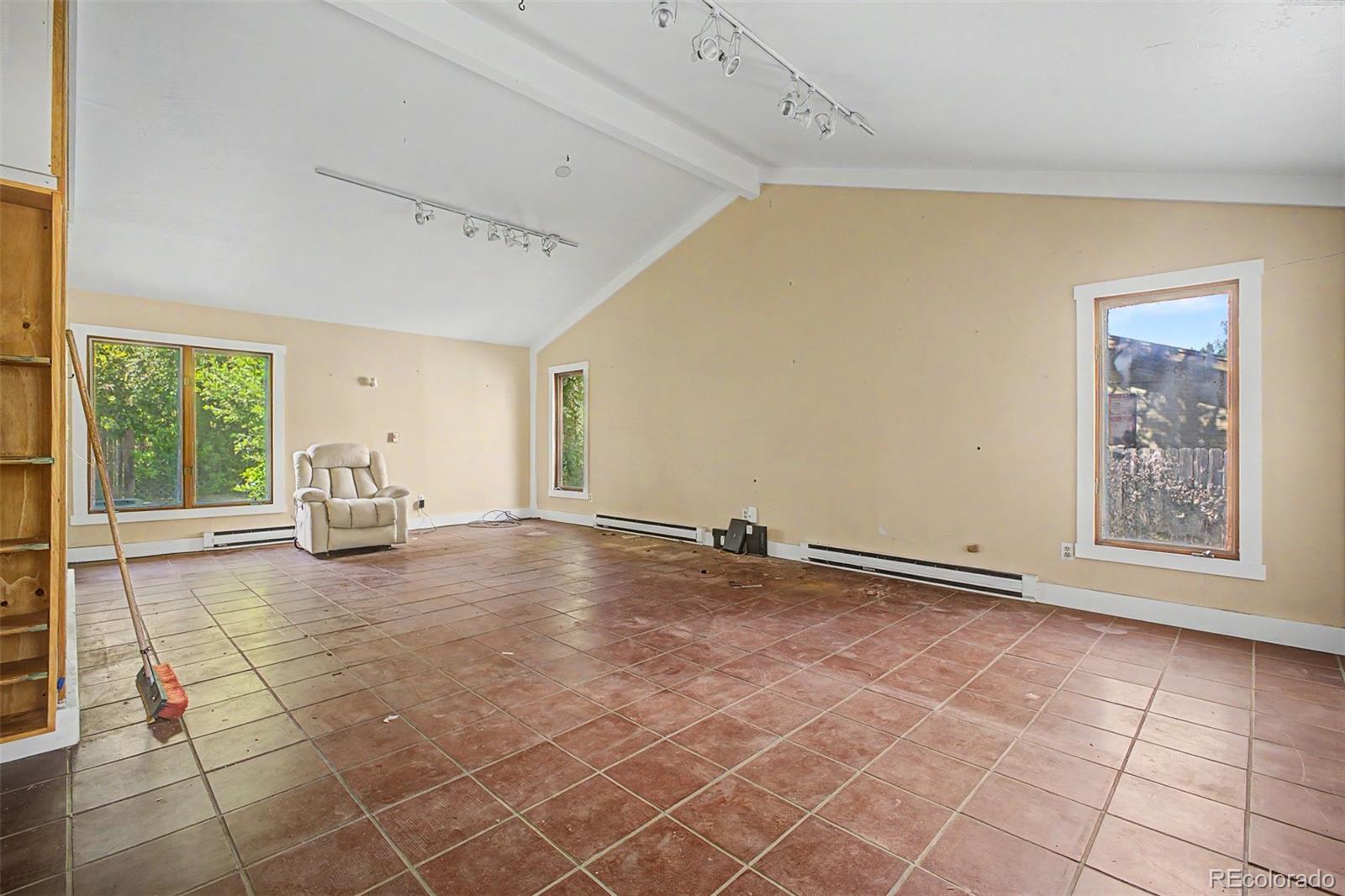 1600 Northwestern Road Longmont, CO 80503 - Photo 25 of 41 a view of empty room with floor to ceiling window and potted plants