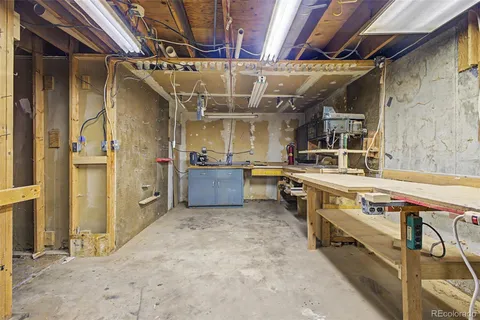 a view of a bedroom with furniture and windows