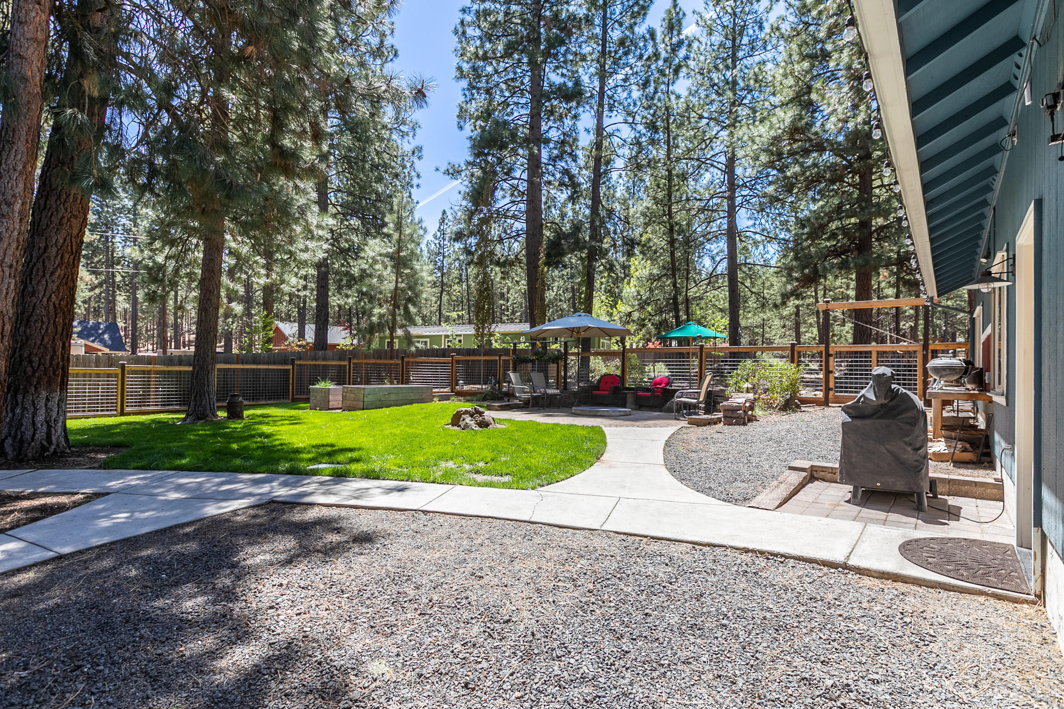 19175 Kiowa Road Bend, OR 97702 - Photo 23 of 44 Looking at backyard from between house and shop