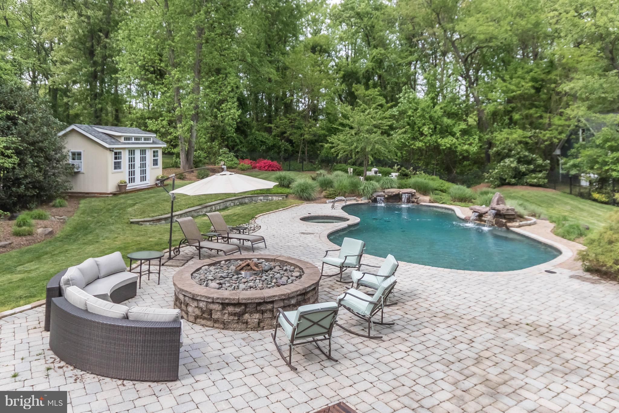 ...replete with two hot tubs, stone terracing..