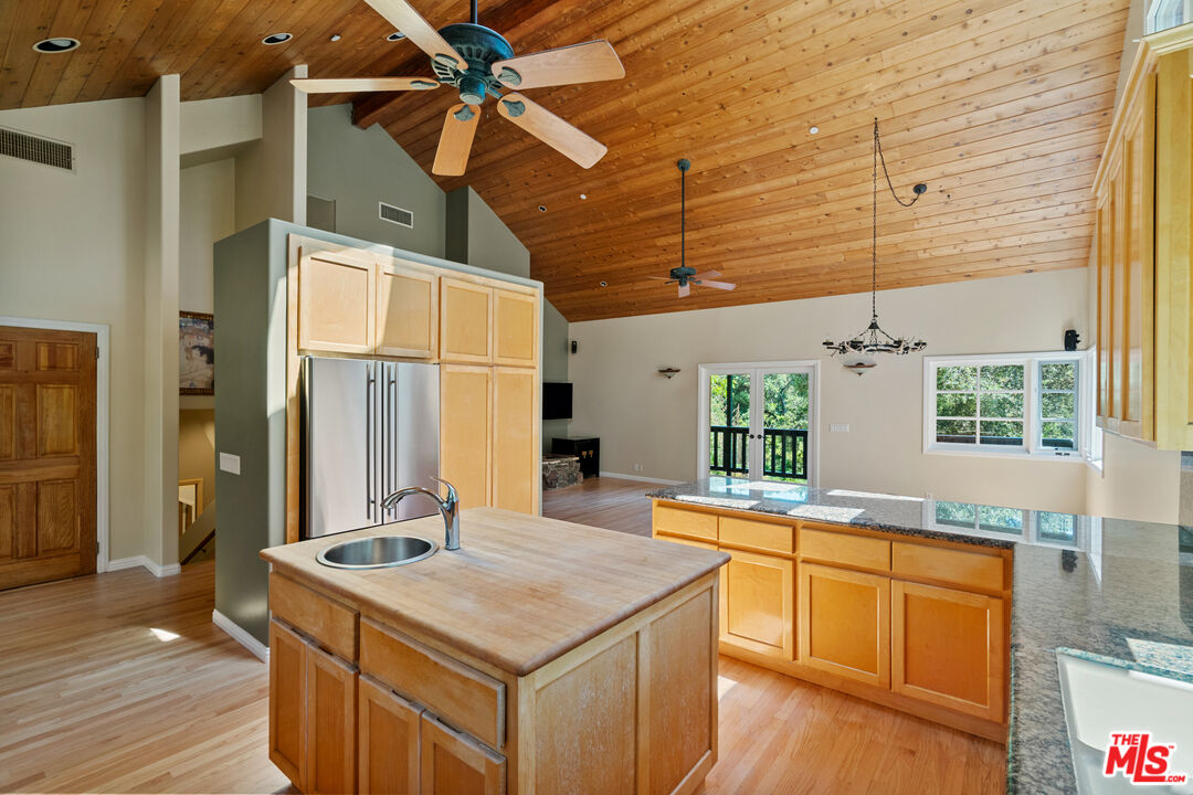 20912 Fontaine Road Topanga, CA 90290 - Photo 14 of 52 a kitchen with a stove and a refrigerator