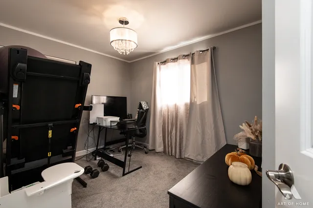 a view of workspace with a window and couch