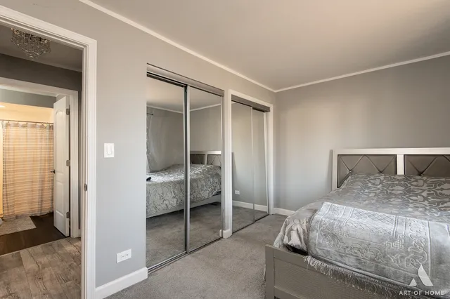 a bedroom with a bed and a cabinets