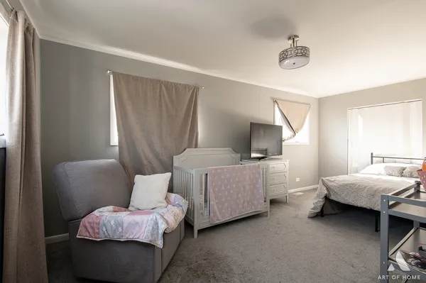 a bedroom with bed and window