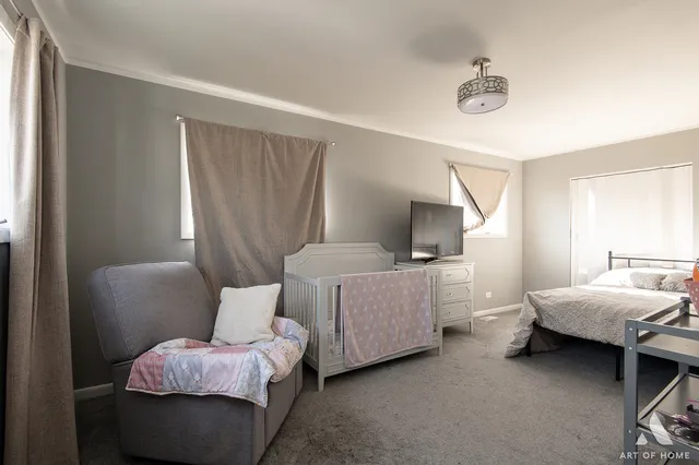 a bedroom with bed and window