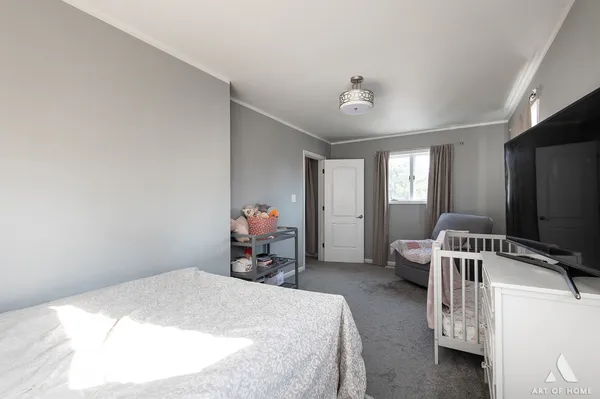 a bed room with a bed and a tv