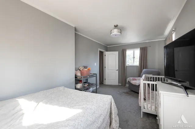 a bed room with a bed and a tv