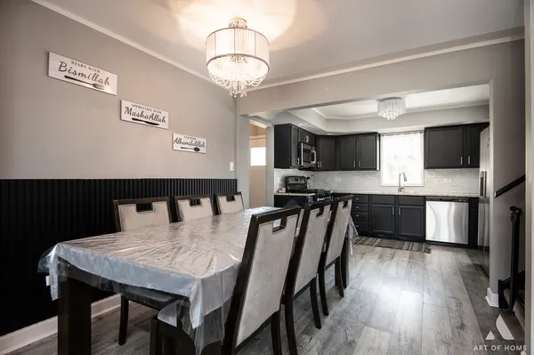a view of a dining room with furniture and wooden floor
