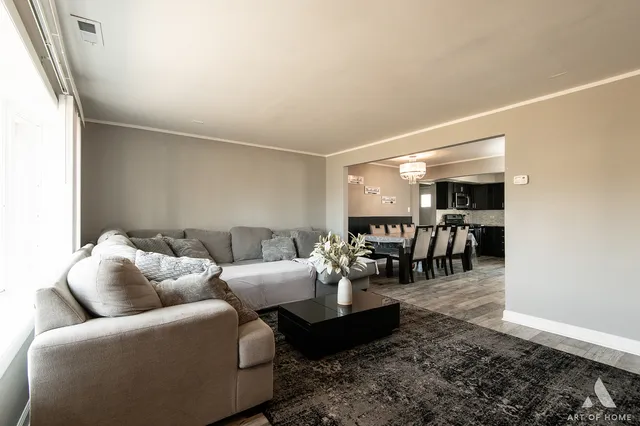 a living room with furniture and a table