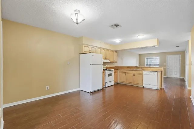 a view of kitchen with wooden floor