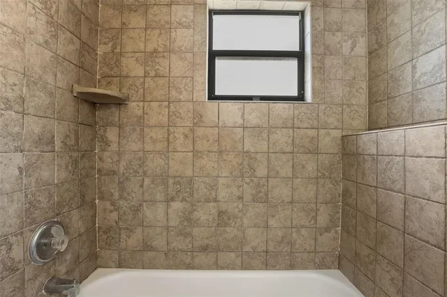a bathroom with a bathtub