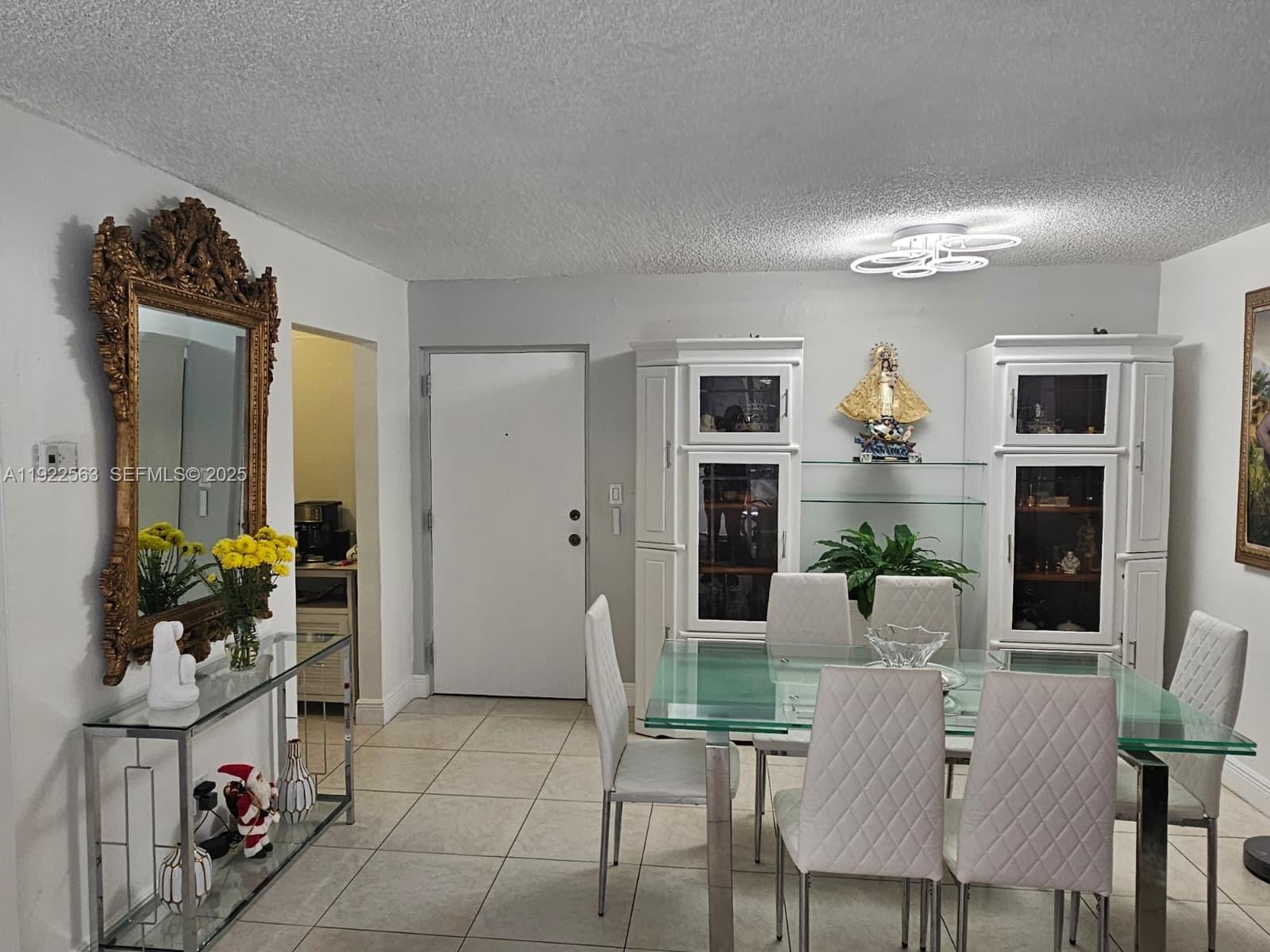 8411 Northwest 8th Street, Unit 111 Miami, FL 33126 - Photo 11 of 27 a living room with furniture and a wooden floor