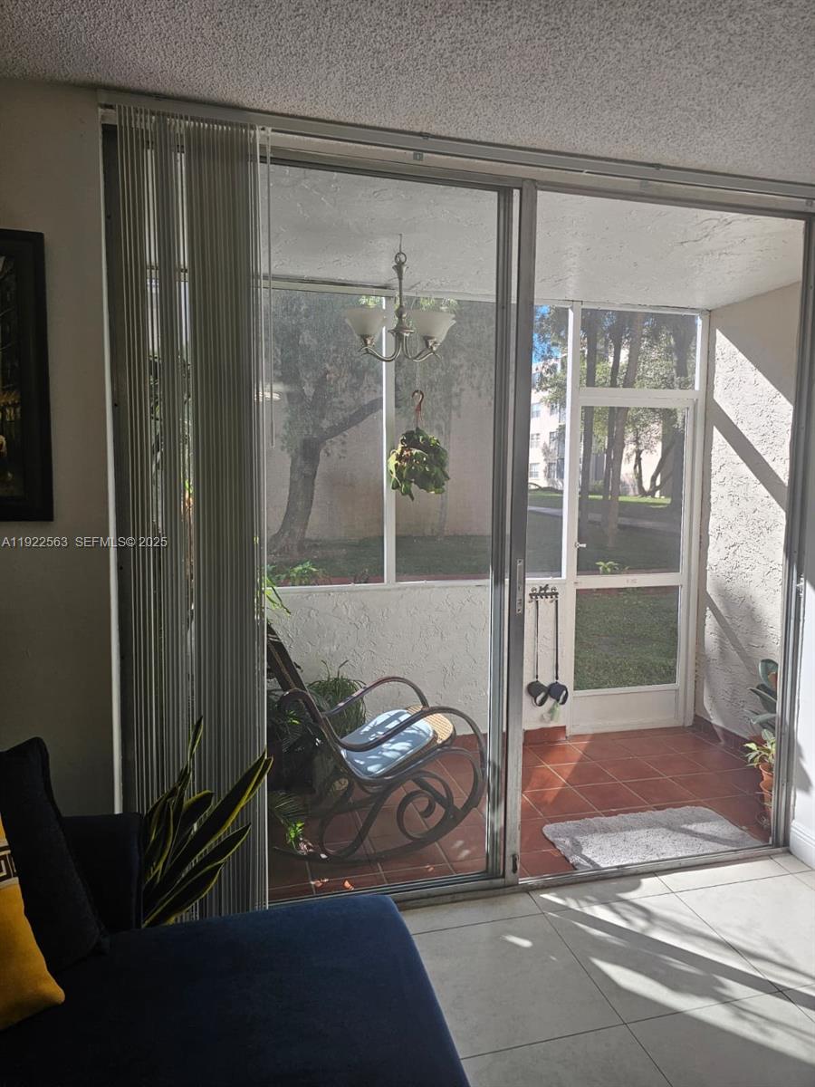 8411 Northwest 8th Street, Unit 111 Miami, FL 33126 - Photo 3 of 27 a view of a entrance door of the house