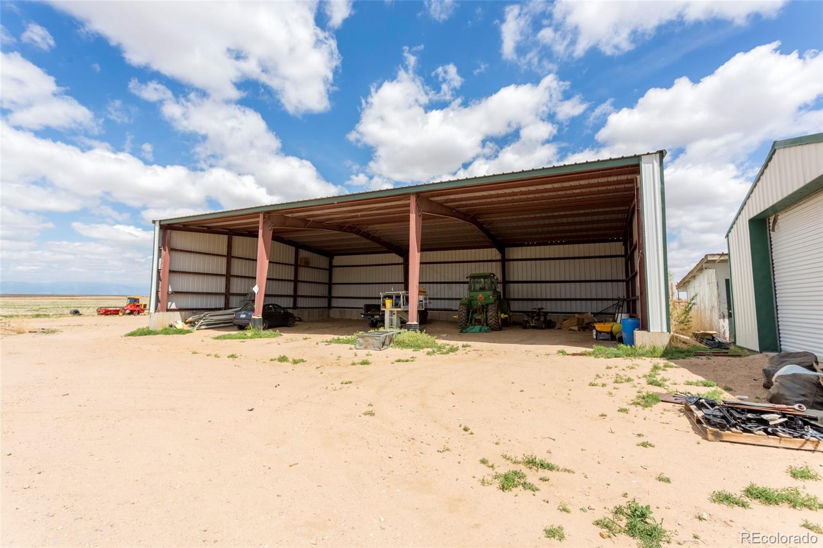 21550 Hanover Road Colorado Springs, CO 80928 - Photo 15 of 29 a view of a house with wooden fence
