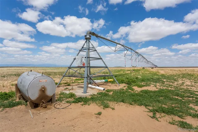 a view of a backyard with a table and chairs