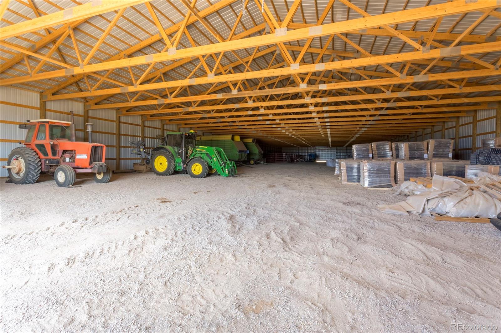 21550 Hanover Road Colorado Springs, CO 80928 - Photo 9 of 29 a view of a garage with parked cars