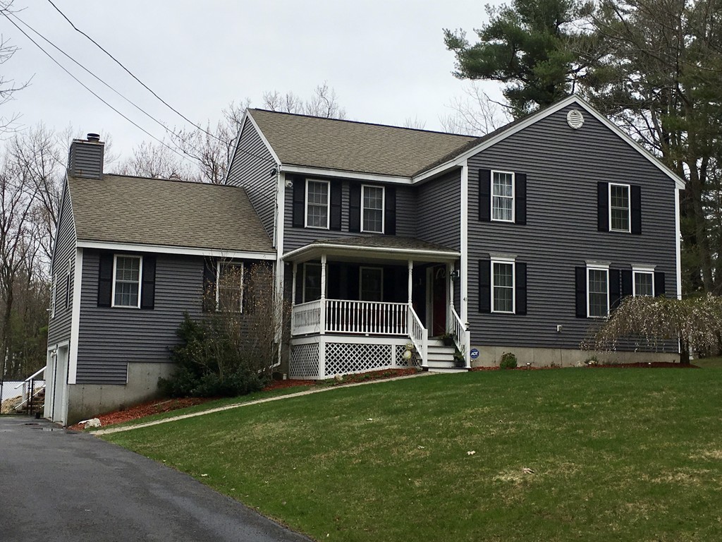 41 Prescott Street Rutland, MA 01543 - Photo 1 of 30 a front view of a house with a yard
