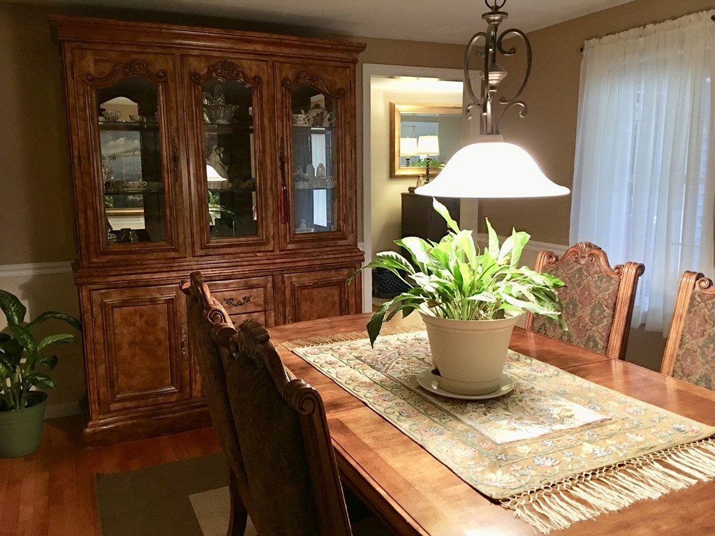 41 Prescott Street Rutland, MA 01543 - Photo 12 of 30 a dining room with furniture and a potted plant