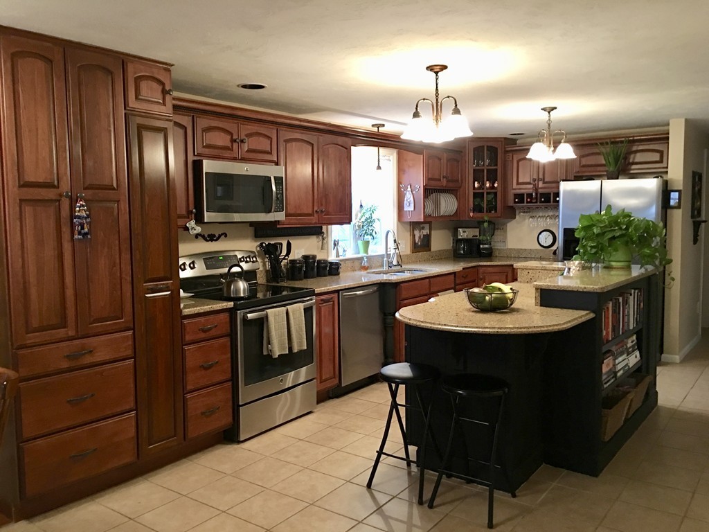 41 Prescott Street Rutland, MA 01543 - Photo 7 of 30 a kitchen with a sink refrigerator and cabinets