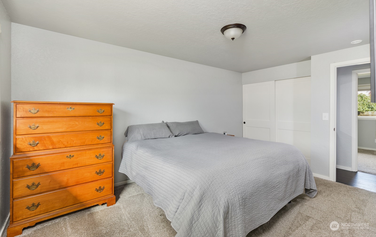 827 Natalie Place Enumclaw, WA 98022 - Photo 12 of 18 a bedroom with a bed and a dresser