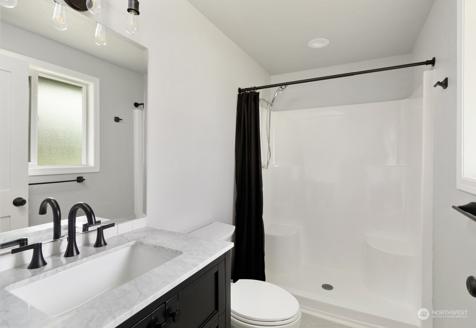 827 Natalie Place Enumclaw, WA 98022 - Photo 13 of 18 a bathroom with a granite countertop sink toilet and shower