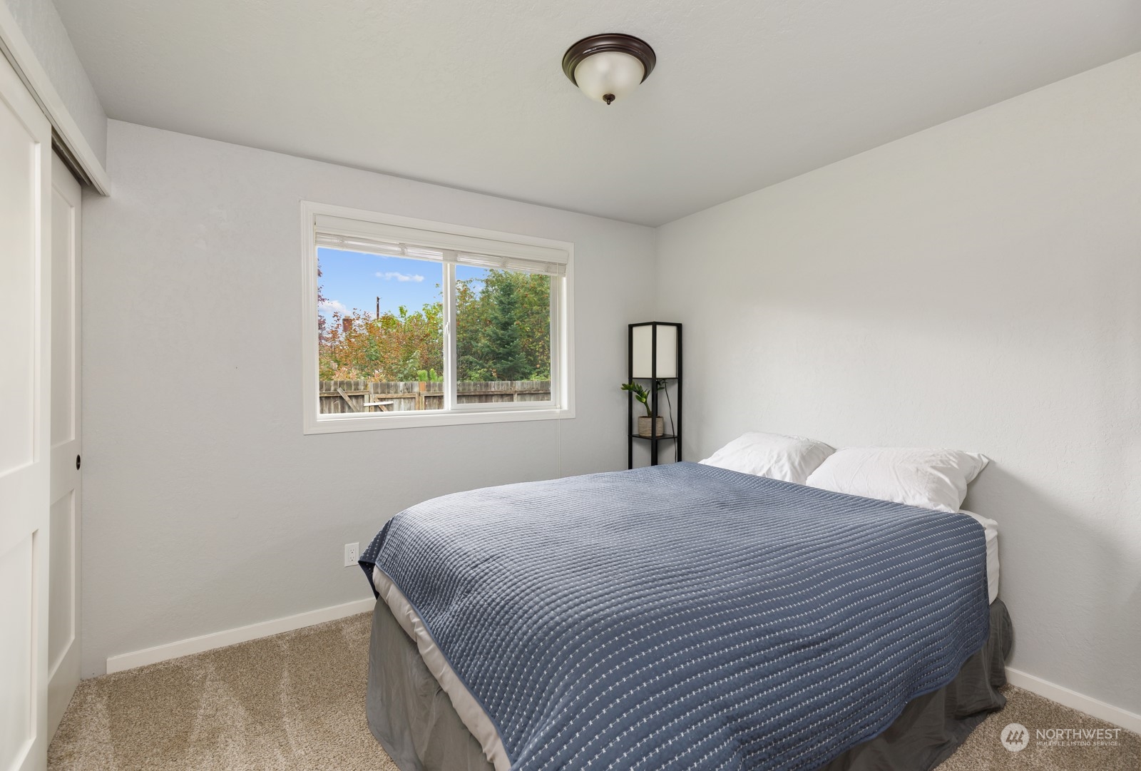 827 Natalie Place Enumclaw, WA 98022 - Photo 14 of 18 a bedroom with a bed and a window