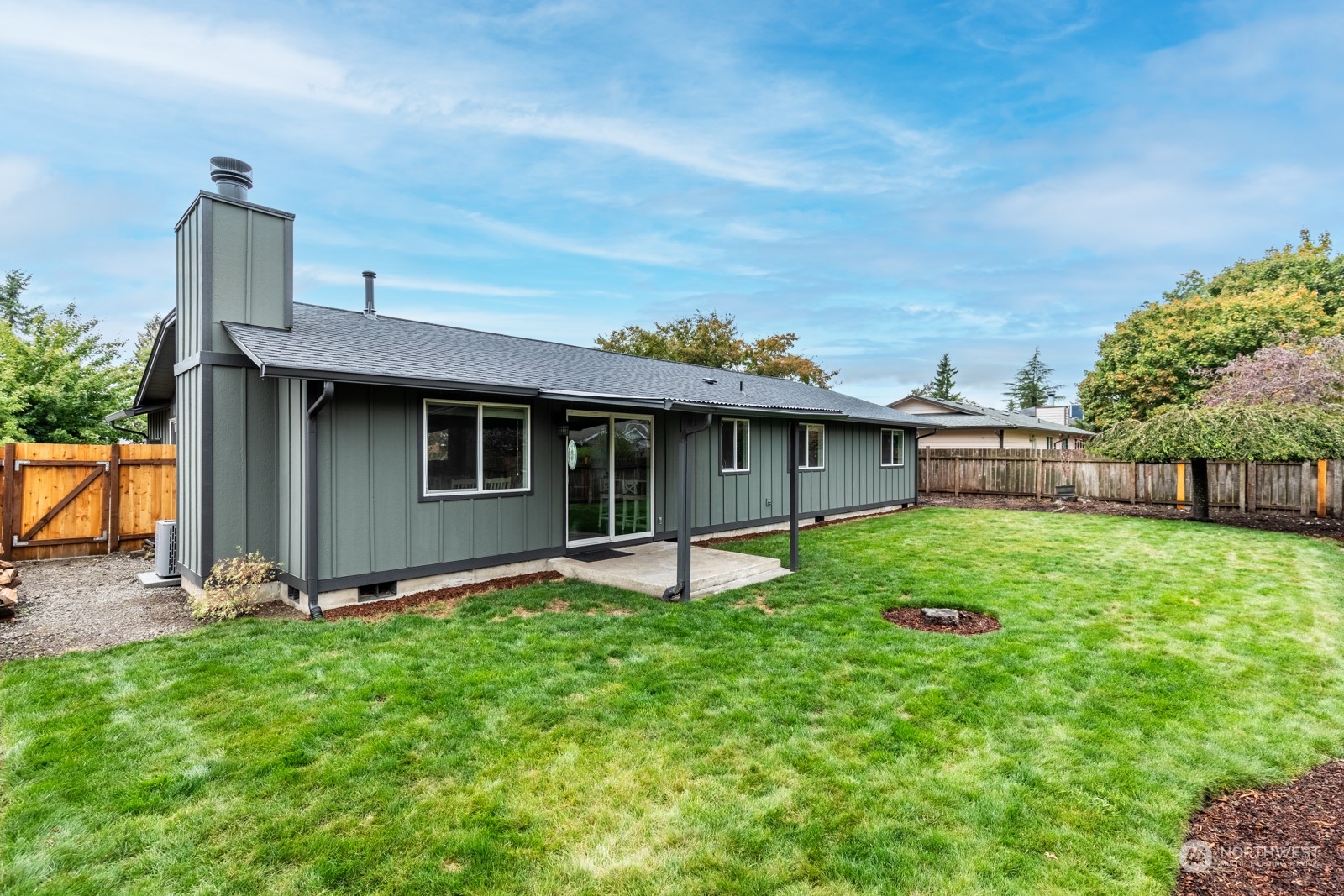 827 Natalie Place Enumclaw, WA 98022 - Photo 16 of 18 a view of a house with a yard and sitting area
