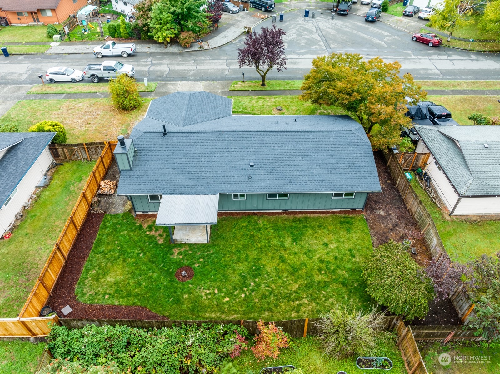 827 Natalie Place Enumclaw, WA 98022 - Photo 18 of 18 an aerial view of a house with swimming pool and large trees