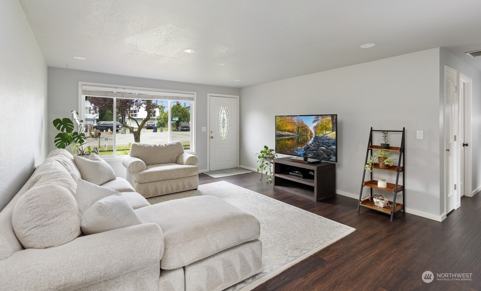 827 Natalie Place Enumclaw, WA 98022 - Photo 2 of 18 a living room with furniture and a flat screen tv